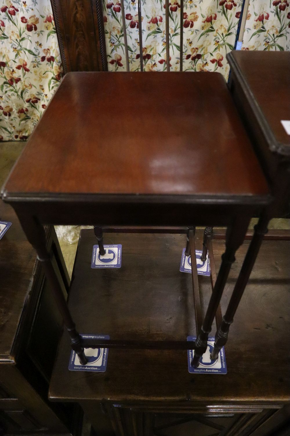 An Edwardian nest of three mahogany tea tables, width 51cm depth 36cm height 61cm